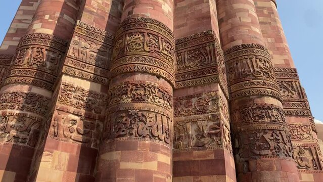 Inscriptions made on the wall of Qutub Minar build by Qutb al-Din Aibak. 4K 60p pan shot of engraving on the pillar at Qutub Minar complex in Delhi, India