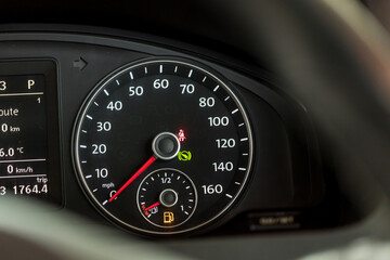 Empty fuel warning light in car dashboard. Fuel pump icon. gasoline gauge dash board in car with digital warning sign of run out of fuel turn on. Low level of fuel show on speedometer dashboard.
