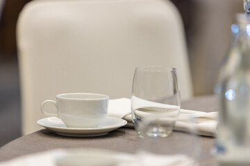 Empty white coffee cup  or tea cup on  table. 