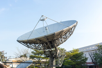 satellite dish radar antenna station in field. parabolic antennas. Big parabolic antenna against sky. Satellite dish at earth station with a sky. - obrazy, fototapety, plakaty
