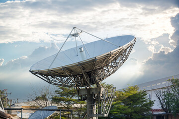 satellite dish radar antenna station in field. parabolic antennas. Big parabolic antenna against sky. Satellite dish at earth station with a sky. - obrazy, fototapety, plakaty