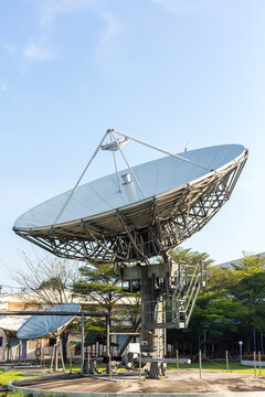 satellite dish radar antenna station in field. parabolic antennas. Big parabolic antenna against sky. Satellite dish at earth station with a sky.