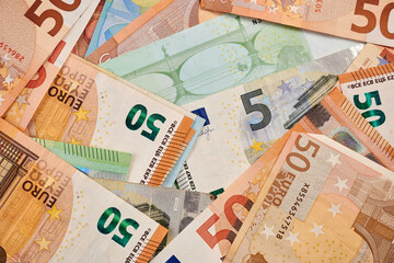 Dollars and Euro banknotes - photo of real money. Dollars and Euro as background for financial concept. Commercial result of trading. Real money for productive business. EUR paper. Fiat currency.