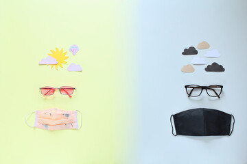 Concept showing the opposite ways of dealing with the Covid-19 pandemic. Pink glasses and sun - a...