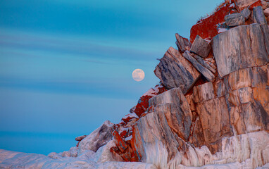 Winter Siberian landscape with Ogoy Island on Lake Baikal moonshine in the background - Baikal Lake