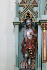 St. Florian, statue on the Altar of St. Anthony of Padua in the parish church of Saints Simon and Jude in Ciglena, Croatia - obrazy, fototapety, plakaty