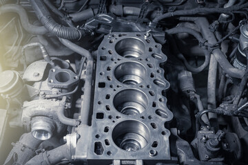 Disassembled car engine without cylinder head. Repair of an old turbocharged diesel engine in a car workshop.