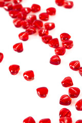 read heart-shaped beads isolated on white background