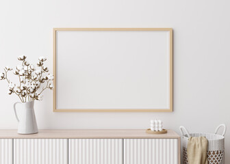 Empty horizontal picture frame on white wall in modern living room. Mock up interior in minimalist, contemporary style. Free space for your picture, poster. Console, cotton plant. 3D rendering.