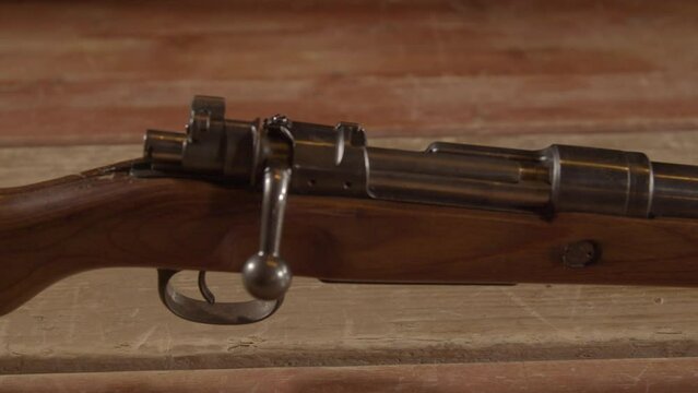 Dolly towards closed bolt and trigger of old Mauser Kar98 rifle