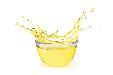 Fototapeta na wymiar Cooking oil splash from glass bowl isolated on white background.