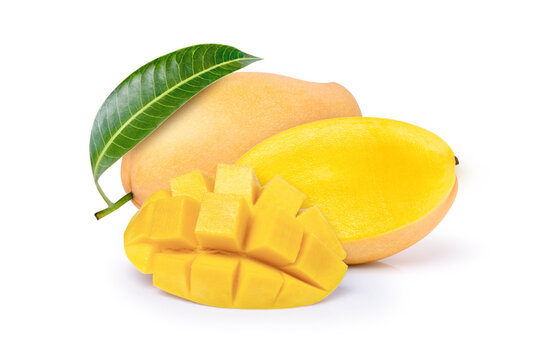 Closeup yellow ripe mango with green leaf and cut in half sliced isolated on white background.