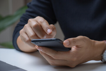  man using a smartphone, close-up