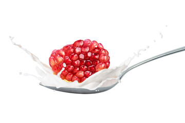 Milk or yogurt splash with fresh pomegranate fruit isolated on white background.