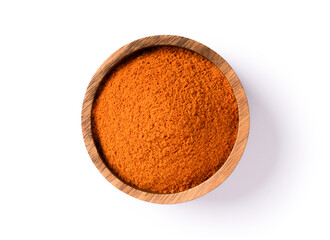 Turmeric powder (curcumin, Curcuma longa Linn) in wooden bowl isolated on white background with clipping path. Top view. Flat lay.