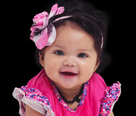 Shes a sweetie. Studio portrait of an adorable baby girl isolated on black.