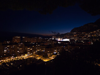 Fototapeta premium Beautiful night view of marina Port de Fontvieille in Monaco at the French Riviera with modern apartment buildings and illuminated stadium.