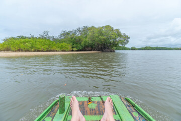 Raft ride on Ipojuca River in the region of Camboa beach, Ipojuca - PE, Brazil next to the mangroves.