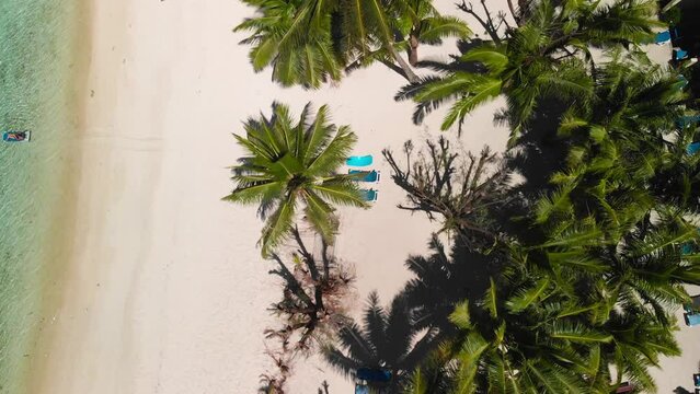 Cook Island - Flying over white sand beach in Rarotonga Island. Drone footage