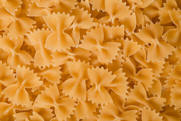 Dry organic farfalle pasta. Raw food texture.