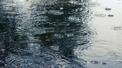River in the rain. Water surface during a downpour
