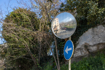 Reflections of the road from traffic convex mirror pole for car traffic safety