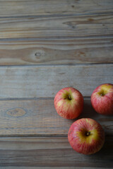 fresh apples on wooden background