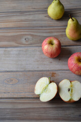 fresh apples and pears on wooden background
