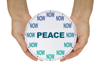 PEACE NOW concept - female hands holding a clock with no hands but with NOW in place of the numbers...