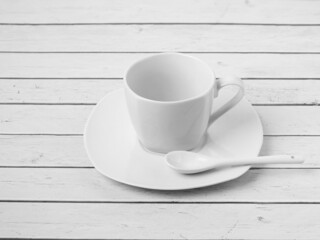 Fototapeta na wymiar coffee cup on a white wooden table