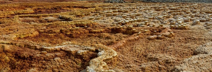 Panorama of surreal colors and Mars like landscape created by Sulphur springs in the hottest place on earth, the Danakil Depression in the Afar Region of Ethiopia.