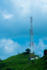 tall tower among tea plantations on a sunny day in ciwidey bandung, indonesia