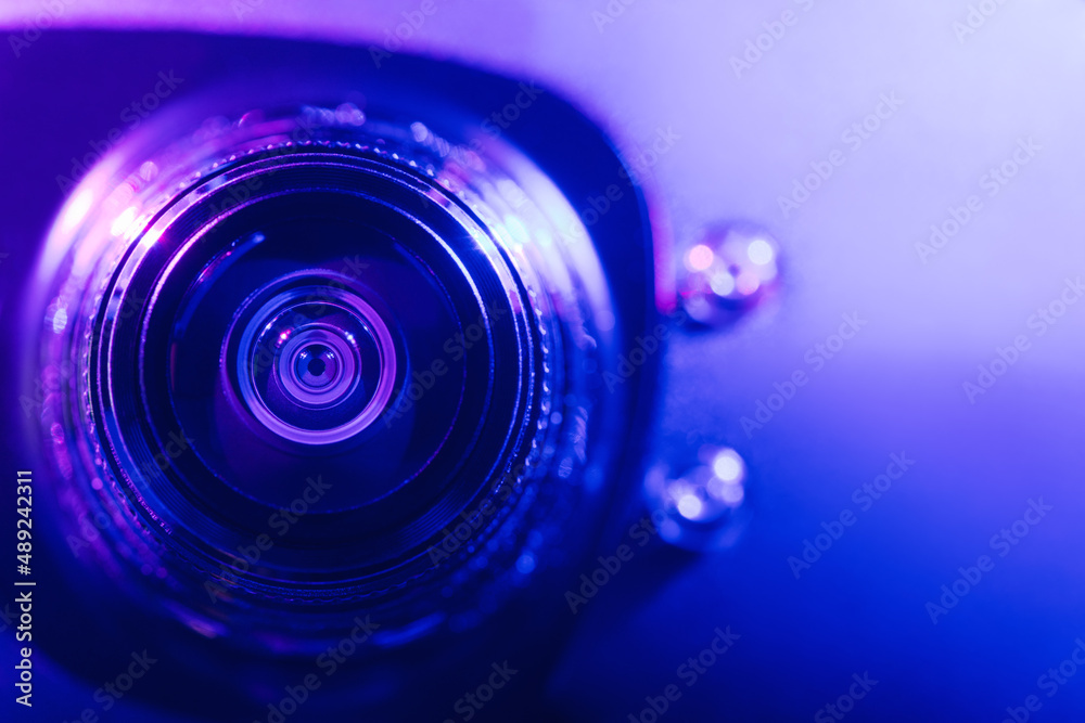 Wall mural .camera lens with purple and blue backlight. optics