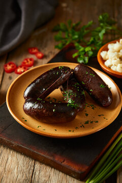 Morcilla, a traditional Ecuadorian sausage. On a wooden background