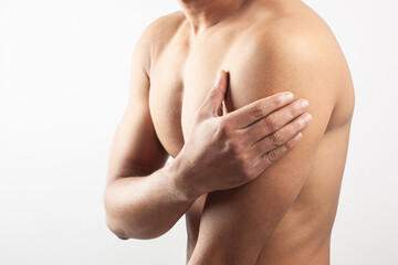 Fototapeta premium man holding his deltoids muscle