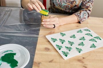 process of printing with wooden stamps. workshop.