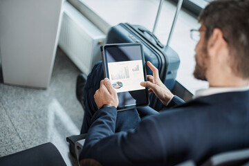 businessman using a digital tablet during a business trip.