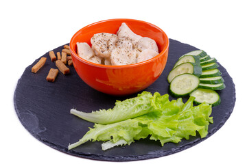 Pelmeni with herbs and breadcrumbs on a slate blackboard
