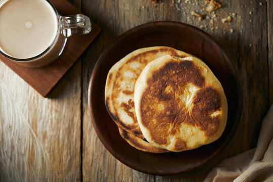 Tortilla de maiz a traditional Ecuadorian appetizer served with coffee. It’s on a wooden background. 