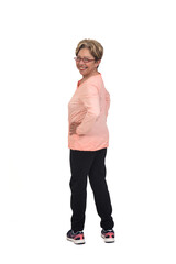 rear view o f a full portrait of senior woman with sportswear looking at camera on white background