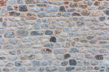 Stone wall texture background. Old stonewall traditional pattern building facade, natural material