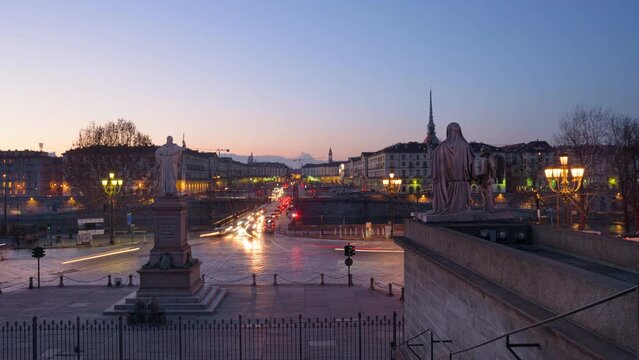 Turin, Italy. February 15, 2022. View from the Gran Madre di Dio Church on the evening car traffic on Corso Casale toward Vittorio Emanuele I Bridge. From Dusk to Night zoom in Timelapse.