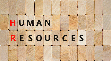 HR Human resources symbol. Concept words HR Human resources on wooden blocks on a beautiful wooden background. Business and HR human resources concept.