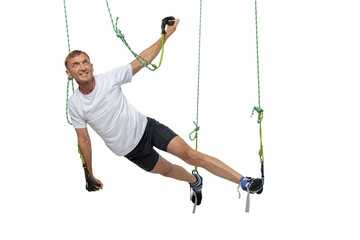 Man working out in gym with alfa gravity system isolated on white background.
