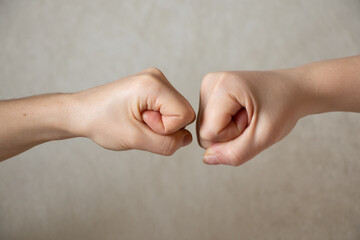 two fists on an isolated background, strength and power, fight and war, stop war