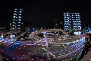 A night timelapse traffic jam at the crossing in Tokyo wide shot