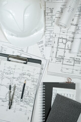 architect design working drawing sketch plans blueprints and making architectural construction model in architect studio,flat lay.