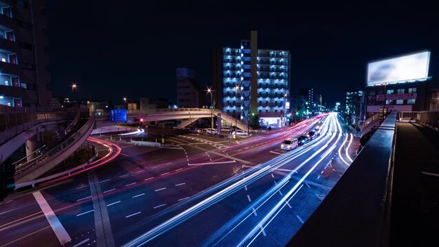 A night timelapse of the traffic jam at the crossing in Tokyo wide shot