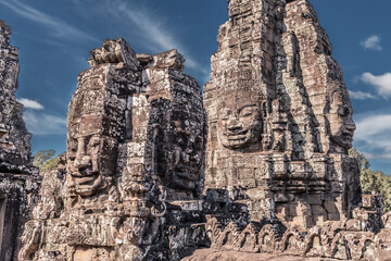 Naklejka premium Sacred faces of ancient kings of Cambodia in Bayon temple of Angkor complex, Siem Reap, Cambodia