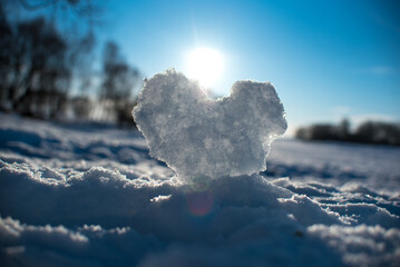 heart snow rays winter.
White backdrop. Cold winter weather. Love background. Holiday concept. Love, romance concept. Snowy winter morning. Snow winter background.